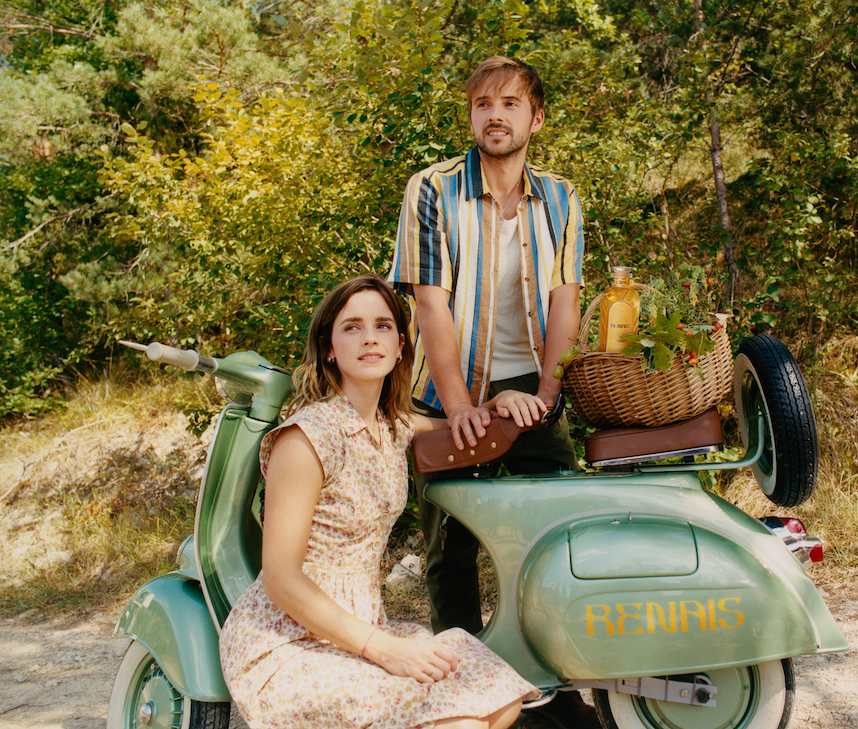 Alex and Emma Watson with a motorcycle and a bottle of Renais